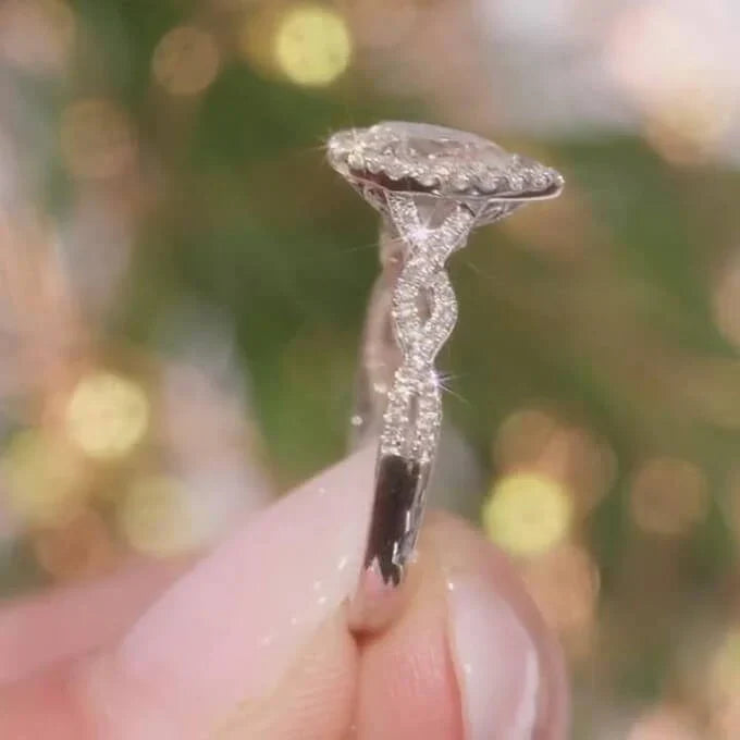 Pear Cut Sterling Silver Twisted Halo Engagement Ring – Juluro