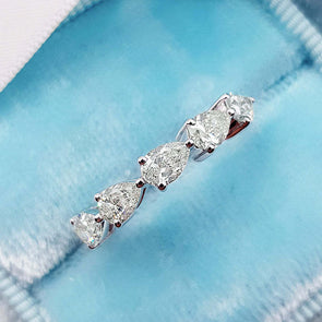 Dainty Pear Cut Eternity Wedding Band In Sterling Silver