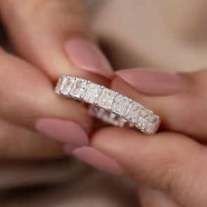 Elegant Radiant Cut Eternity Band In Sterling Silver