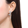 Paved Bowknot Pear Cut Drop Earrings In Sterling Silver