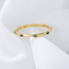 Stylish Golden Tone Wedding Band with Gemstone Accents