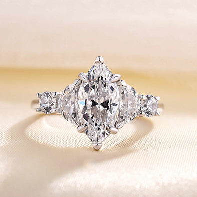 Dainty Marquise Cut Three Stone Engagement Ring In Sterling Silver