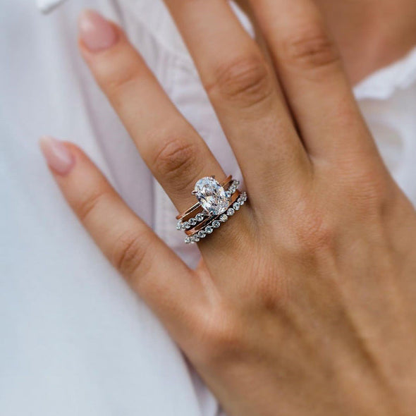 Elegant Oval Cut 4PC Bridal Set In Sterling Silver